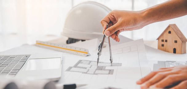 engineer working in office with blueprints, inspection in workplace for architectural plan, construction project ,Business construction	 - Photo, Image