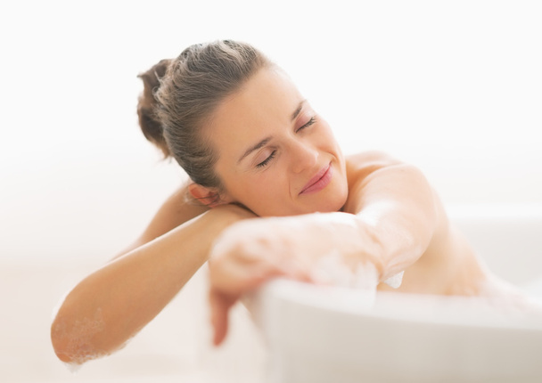 Relaxed young woman in bathtub - Fotó, kép