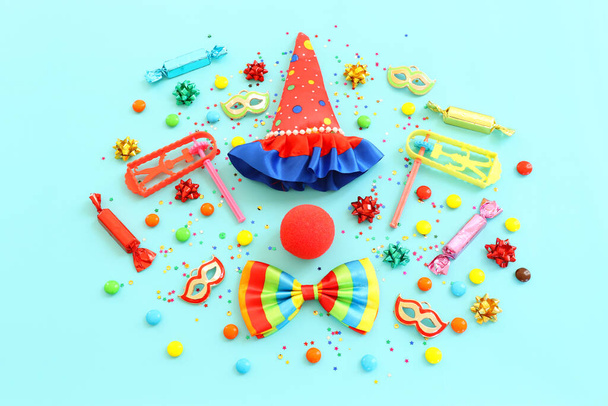 carnival, party and Purim celebration concept (jewish carnival holiday) over blue background - Zdjęcie, obraz