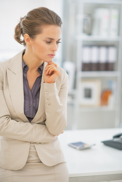Thoughtful business woman in office - Photo, image