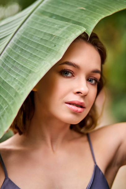 carefree good-looking lady with natural beauty posing in rainforest - Foto, immagini