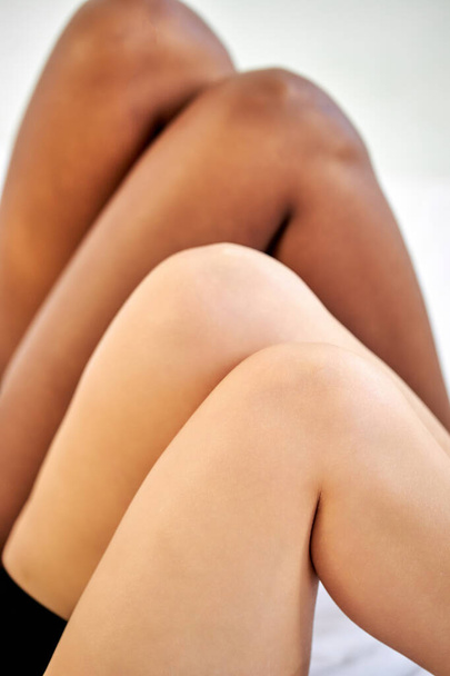 close-up legs of two diverse women - Zdjęcie, obraz