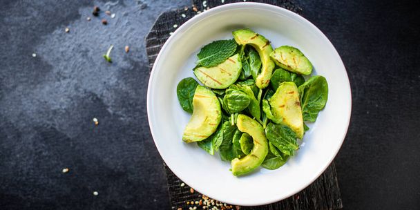 avocado salad vegetable fried grilled lettuce spinach arugula snack barbecue ready to eat on the table healthy meal top view copy space text food background rustic image  - Fotó, kép