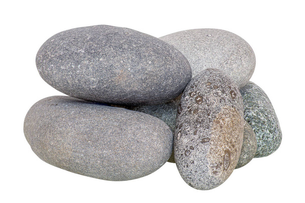 The stones are gray, isolated, stacked in a variety of compositions for use in collages, photographed in a studio in natural daylight, horizontally. - Photo, Image