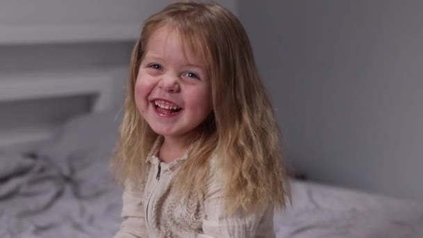 charming little girl having fun, laughing in gray room. morning routine, childhood, daughter. FullHD footage - Footage, Video