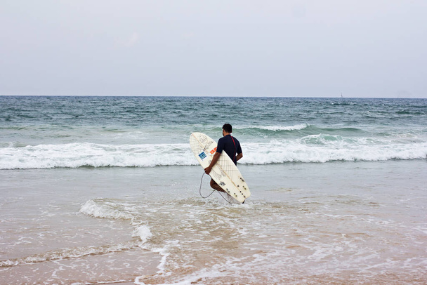 Tel Aviv, Israel, November 2019 - surfer, surfers in the sea are waiting for water . Surfer at sea - 写真・画像