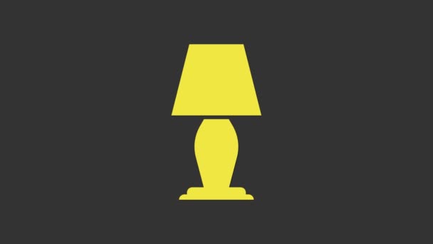 Желтый значок настольной лампы изолирован на сером фоне. Видеографическая анимация 4K - Кадры, видео