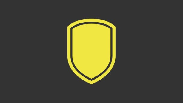 Иконка Желтый щит выделена на сером фоне. Знак охранника. Видеографическая анимация 4K - Кадры, видео