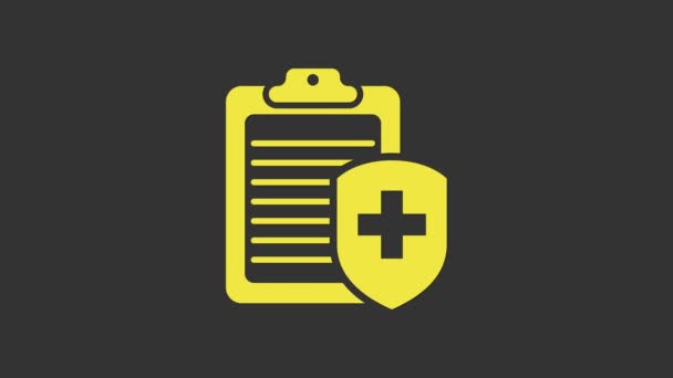 Presse-papiers jaune avec icône d'assurance médicale isolée sur fond gris. Protection des patients. Presse-papiers et bouclier avec une croix. Animation graphique de mouvement vidéo 4K - Séquence, vidéo