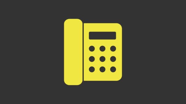 Žlutý telefon ikona izolované na šedém pozadí. Telefon pevnou linkou. Grafická animace pohybu videa 4K - Záběry, video