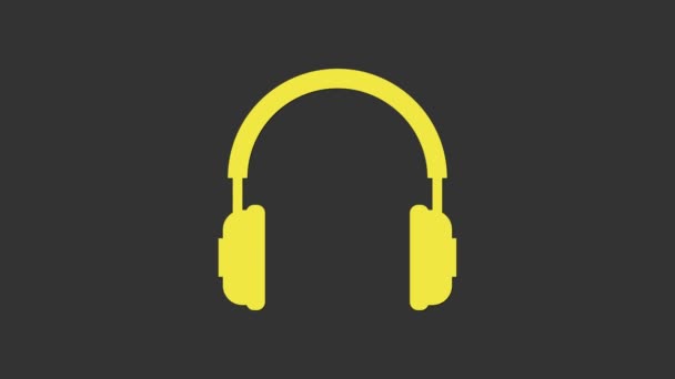 Žluté sluchátka ikona izolované na šedém pozadí. Nápis na sluchátka. Koncepční objekt pro poslech hudby, služby, komunikace a operátora. Grafická animace pohybu videa 4K - Záběry, video