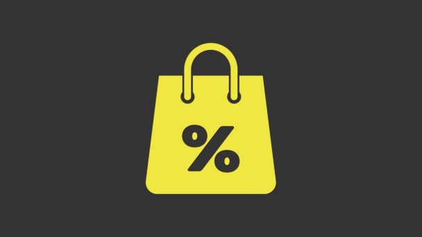 Žlutá nákupní taška s nápisem% sleva ikona izolované na šedém pozadí. Značka kabelky. Ikona ženské tašky. Dámská kabelka. Grafická animace pohybu videa 4K - Záběry, video