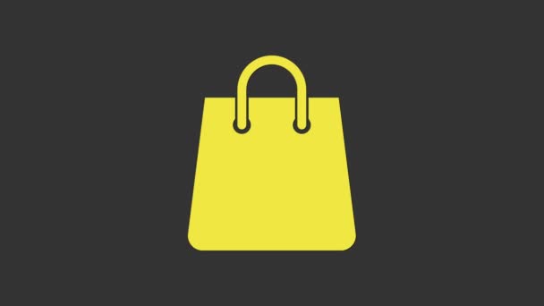 Icono del bolso amarillo aislado sobre fondo gris. Cartel de bolsa de compras. Icono de bolsa de mujer. Señal de bolso femenino. Equipaje casual glamour. Animación gráfica de vídeo 4K - Metraje, vídeo