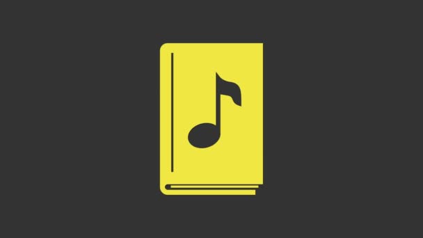 Иконка жёлтой аудиокниги выделена на сером фоне. Музыкальная нота с книгой. Звуковой указатель. Концепция онлайн обучения. Видеографическая анимация 4K - Кадры, видео
