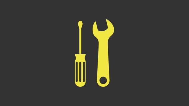 Tournevis jaune et icône des outils de clé isolés sur fond gris. Symbole d'outil de service. Animation graphique de mouvement vidéo 4K - Séquence, vidéo