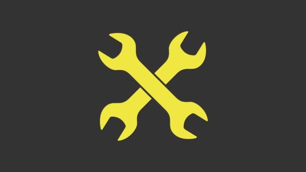 Ikona żółtych kluczy krzyżowych odizolowana na szarym tle. Narzędzie do naprawy kluczy. Symbol narzędzia serwisowego. 4K Animacja graficzna ruchu wideo - Materiał filmowy, wideo