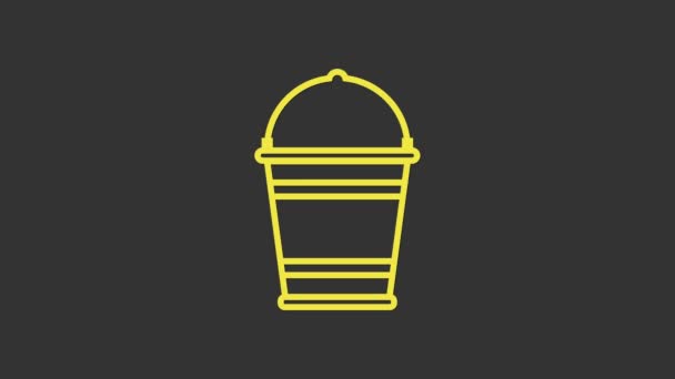 Sárga vödör ikon elszigetelt szürke háttér. 4K Videó mozgás grafikus animáció - Felvétel, videó