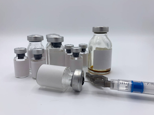 Syringe and vials with blank labels, space to place text - Photo, Image