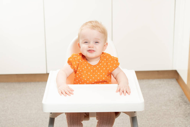 Portrait of Adorable Infant Baby Girl Sitting on the Chair - Фото, изображение