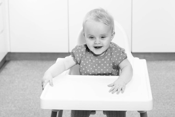 Portrait of Adorable Infant Baby Girl Sitting on the Chair - Φωτογραφία, εικόνα
