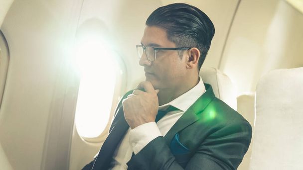 Businessman travel on a business trip by airplane - Photo, Image