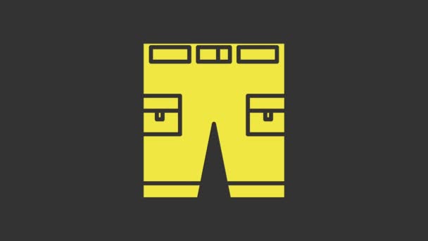 Icône courte ou pantalon jaune isolé sur fond gris. Animation graphique de mouvement vidéo 4K - Séquence, vidéo