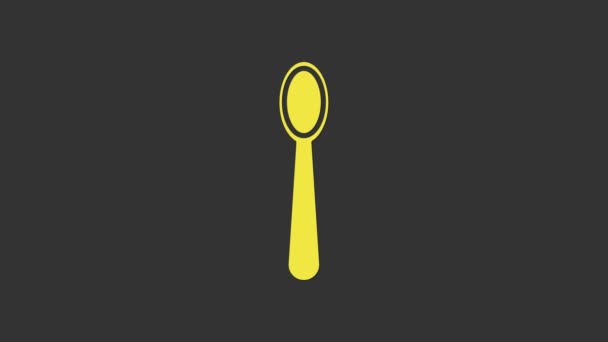 Żółta ikona jednorazowej plastikowej łyżki izolowana na szarym tle. 4K Animacja graficzna ruchu wideo - Materiał filmowy, wideo