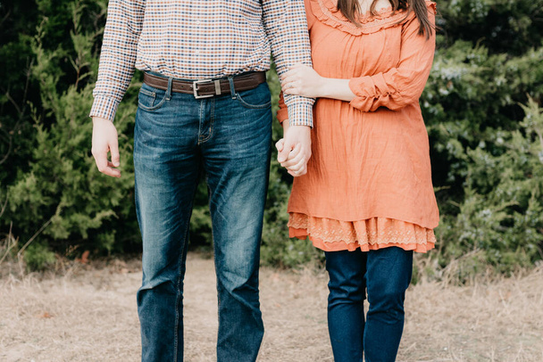 A shallow focus shot of a young couple standing side by side - Photo, image