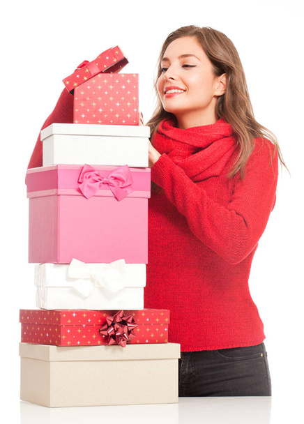 Beautiful young brunette woman with decorative Christmas gift boxes. - Foto, Imagem