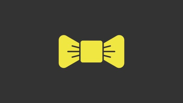 Sárga csokornyakkendő ikon elszigetelt szürke háttér. 4K Videó mozgás grafikus animáció - Felvétel, videó