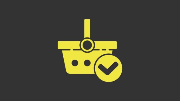 Żółty koszyk z ikoną znaku kontrolnego na szarym tle. Kosz supermarketów z zatwierdzonym, potwierdzonym, zaznaczonym, zakończonym. 4K Animacja graficzna ruchu wideo - Materiał filmowy, wideo