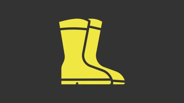 Ikona žluté rybářské boty izolované na šedém pozadí. Vodotěsné gumové boty. Žvýkačky pro deštivé počasí, rybaření, lovce, zahradničení. Grafická animace pohybu videa 4K - Záběry, video