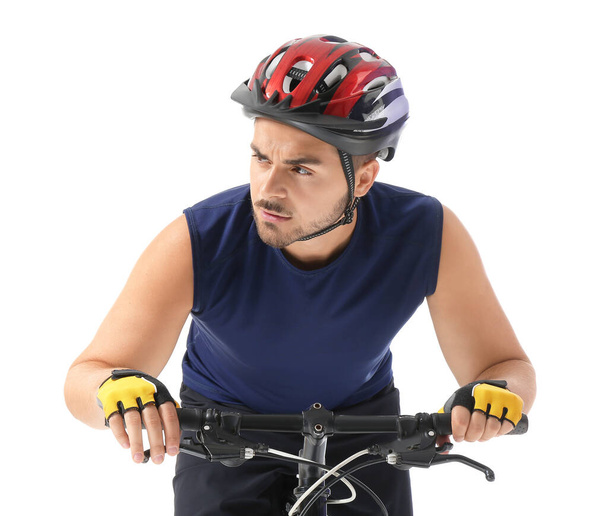 Male cyclist riding bicycle on white background - Foto, afbeelding