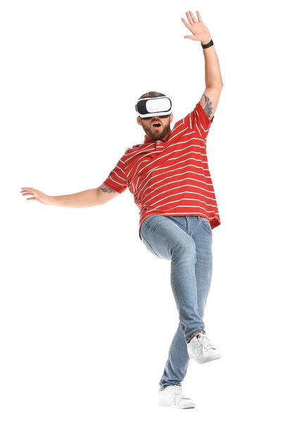 Young man with virtual reality glasses on white background - Zdjęcie, obraz