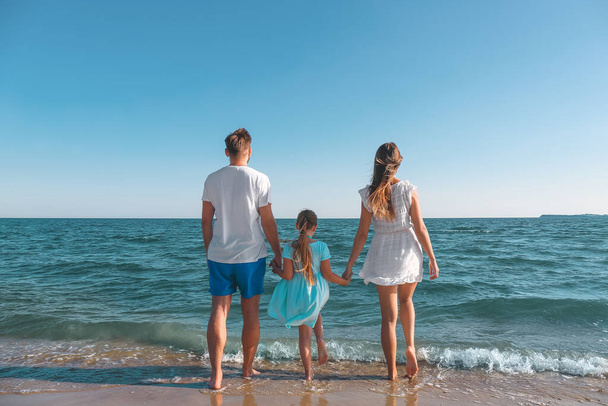 Happy family on sea beach - 写真・画像