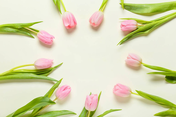 Frame made of tulip flowers on white background - Fotografie, Obrázek