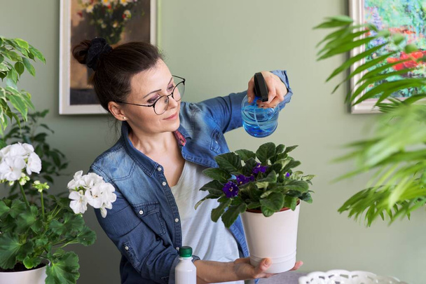 Woman with home plants in pots, hobbies and leisure - Photo, image