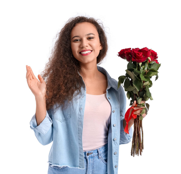 African-American woman with bouquet of beautiful flowers on white background - Foto, imagen