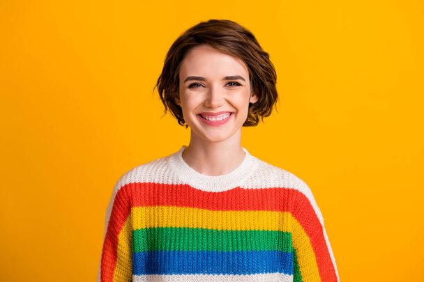 Photo of charming young girl toothy smile look camera wear striped sweater isolated vibrant yellow color background - Valokuva, kuva