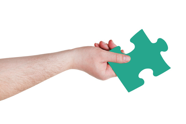 male hand with green puzzle piece - Photo, Image