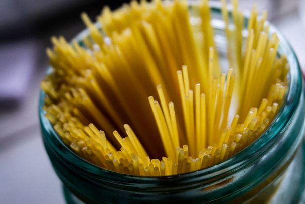 Raw Spaghetti in a glass - Foto, Imagen