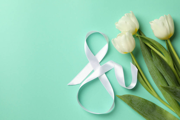 Eight made of ribbon and tulips on mint background - Foto, imagen