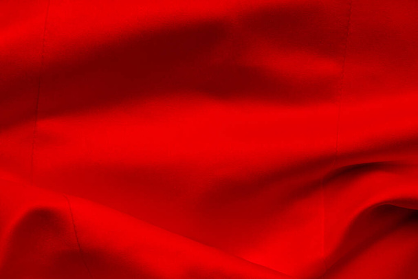 Red wave satin fabric. Bridal wedding dress textile background - Photo, Image