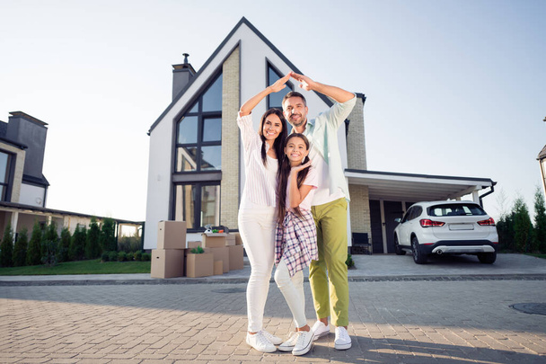 Photo portrait of happy parents with little daughter in front of new home summer cozy insurance secure - Fotografie, Obrázek