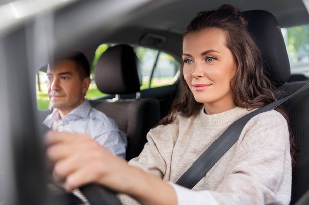 woman and driving school instructor in car - Foto, imagen