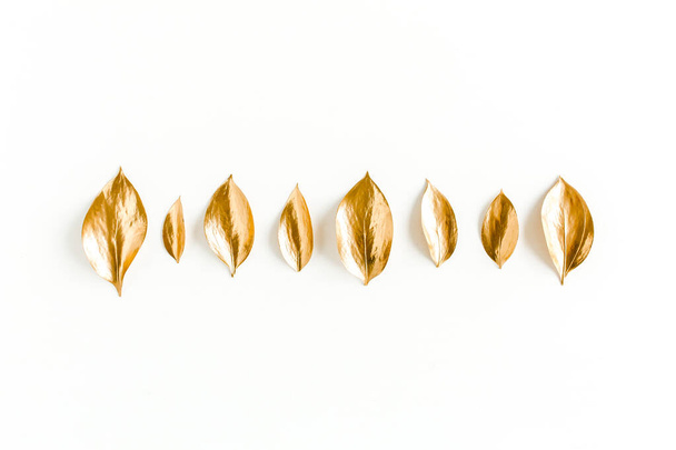 Pattern, texture with gold leaves isolated on white background. flat lay, top view - Photo, Image