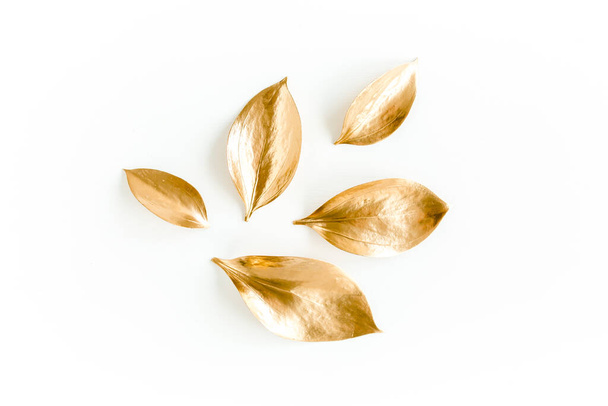 Pattern, texture with gold leaves isolated on white background. flat lay, top view - Zdjęcie, obraz