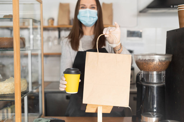 A waitress in a medical mask - Photo, image