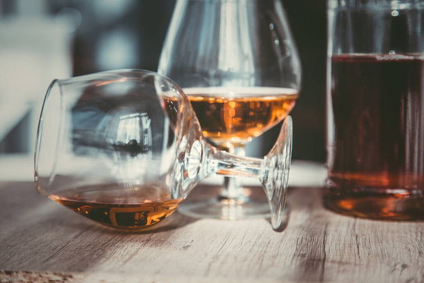 vintage cognac on the table with glasses - 写真・画像