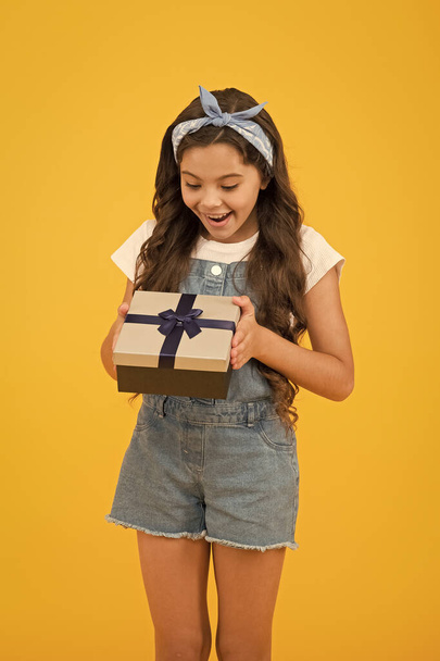 express real happiness. birthday surprise for her. bargain sale concept. black friday discount. summer shopping sales. best presents and gift. little girl open box. surprised kid on yellow background - Foto, imagen
